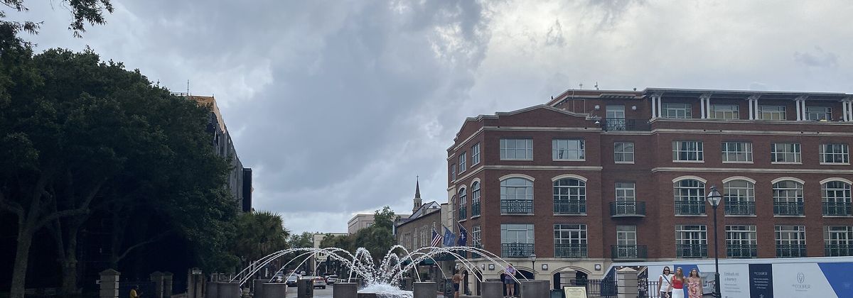 The Splash Fountain at Charleston's Waterfront Park, with the historic brick harborfront behind it