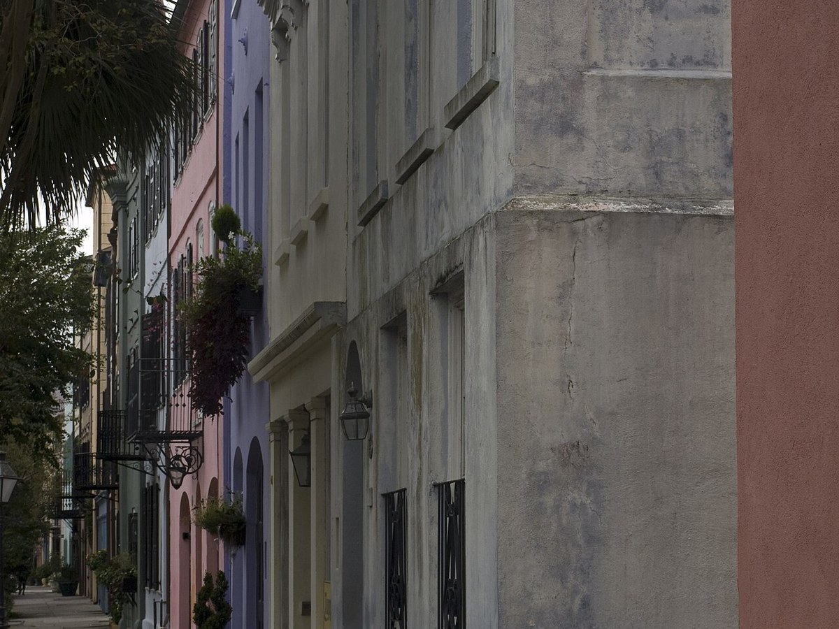 Rainbow Row pastel houses along East Bay Street in Charleston seen from the northern end