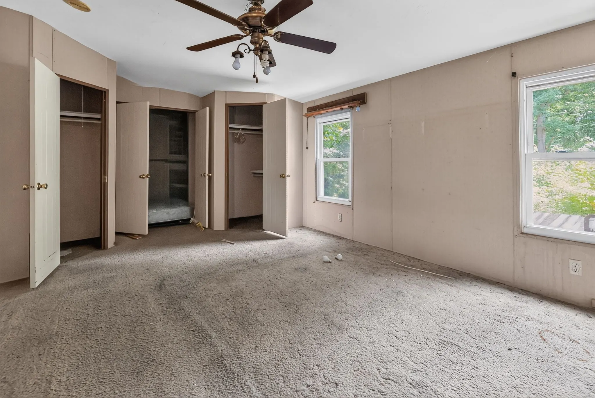 Bedroom with stained carpet at 1929 Revis Pl