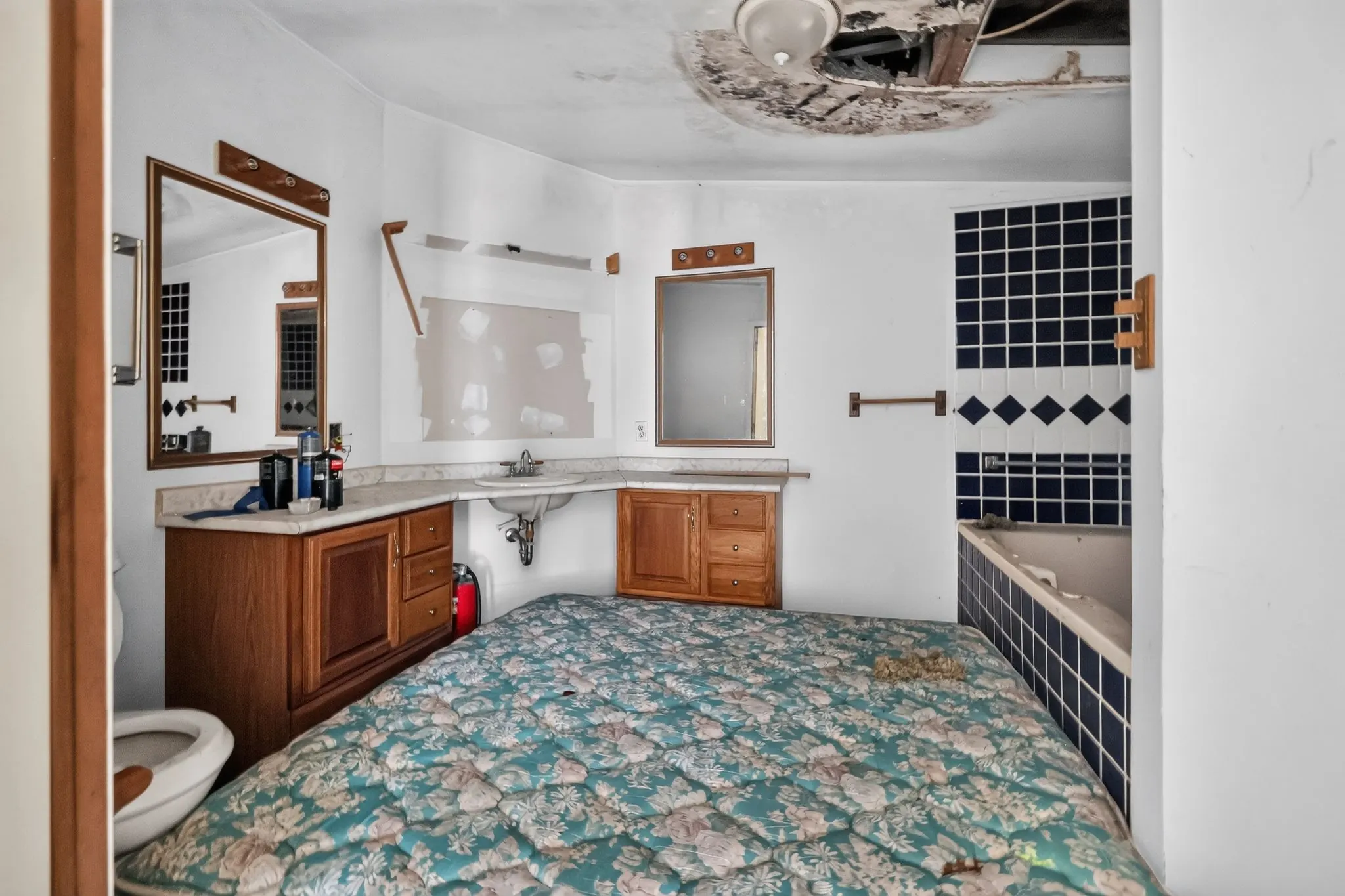 Bathroom with ceiling damage at 1929 Revis Pl