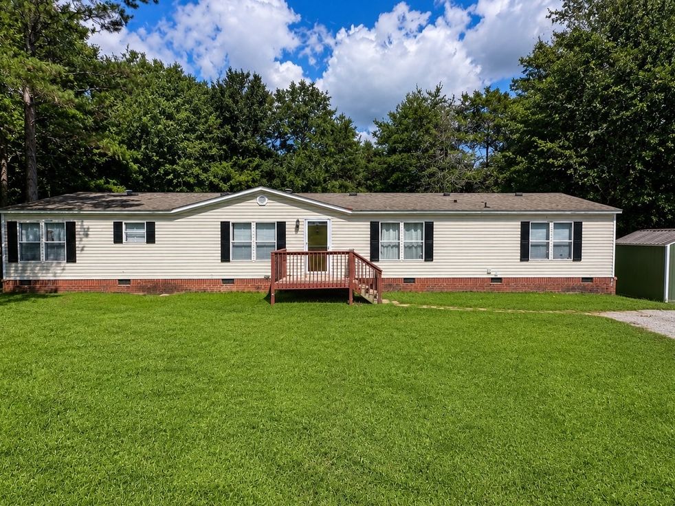 5 Riverbreeze Road, Greenville SC, double-wide home with brick skirting on a large lawn