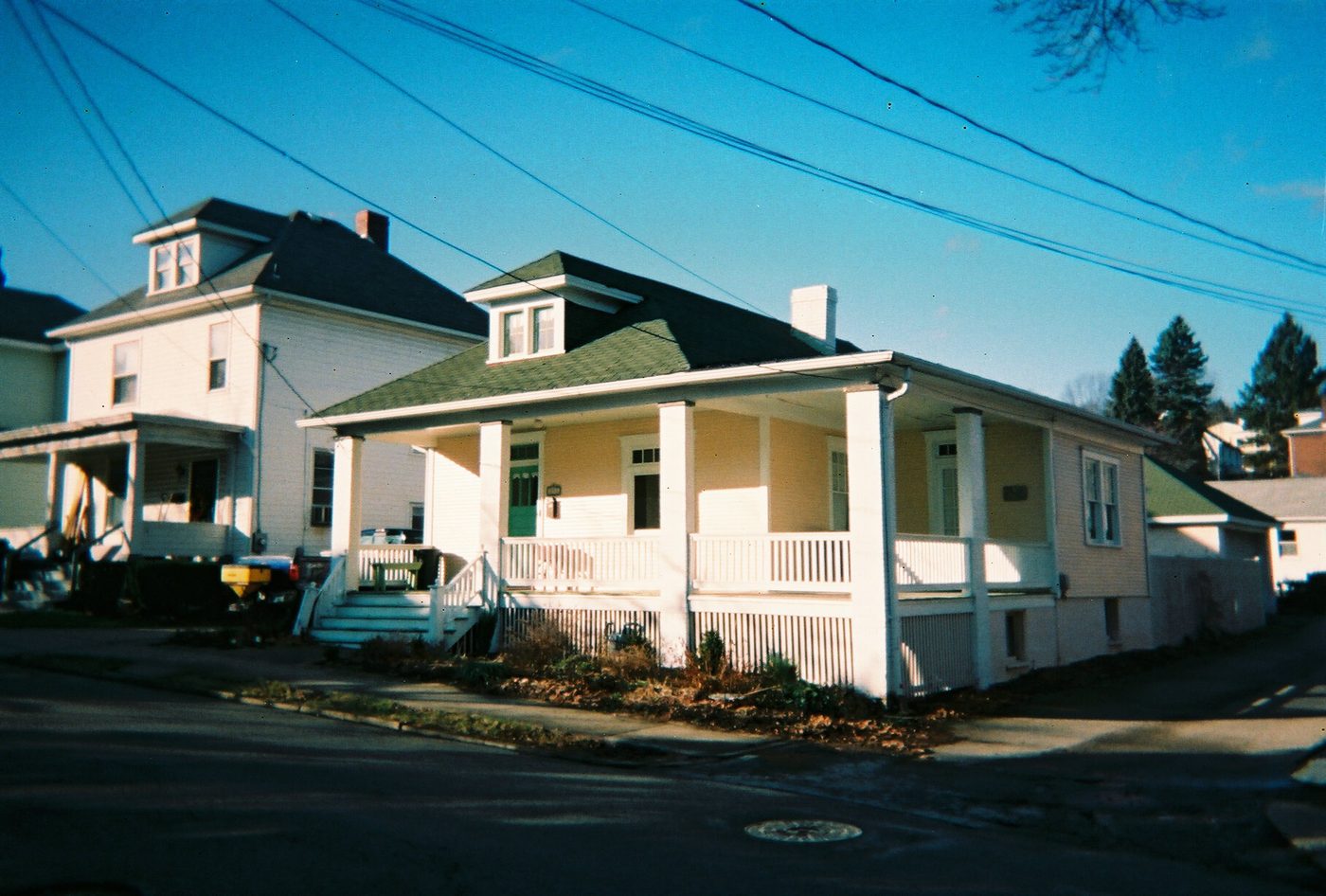 Two early twentieth-century catalog-era houses in Greensburg, Pennsylvania: a porch bungalow and a foursquare