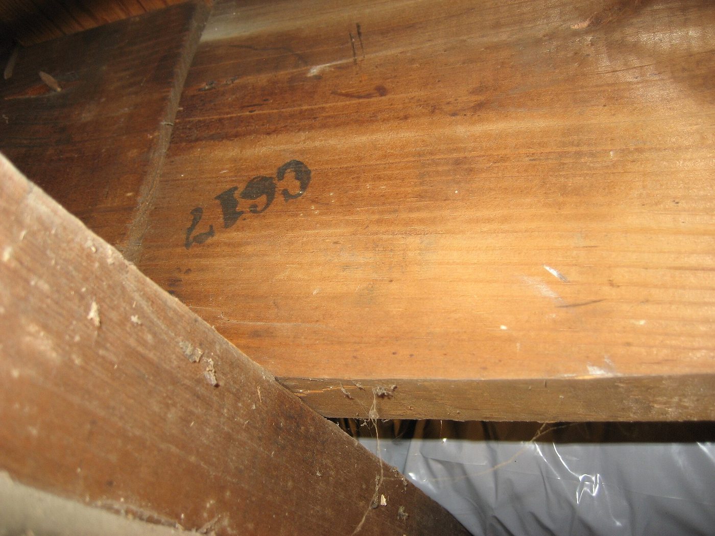 Sears kit-house joist stamped C617, the numbered mark used to match precut lumber to the instruction book