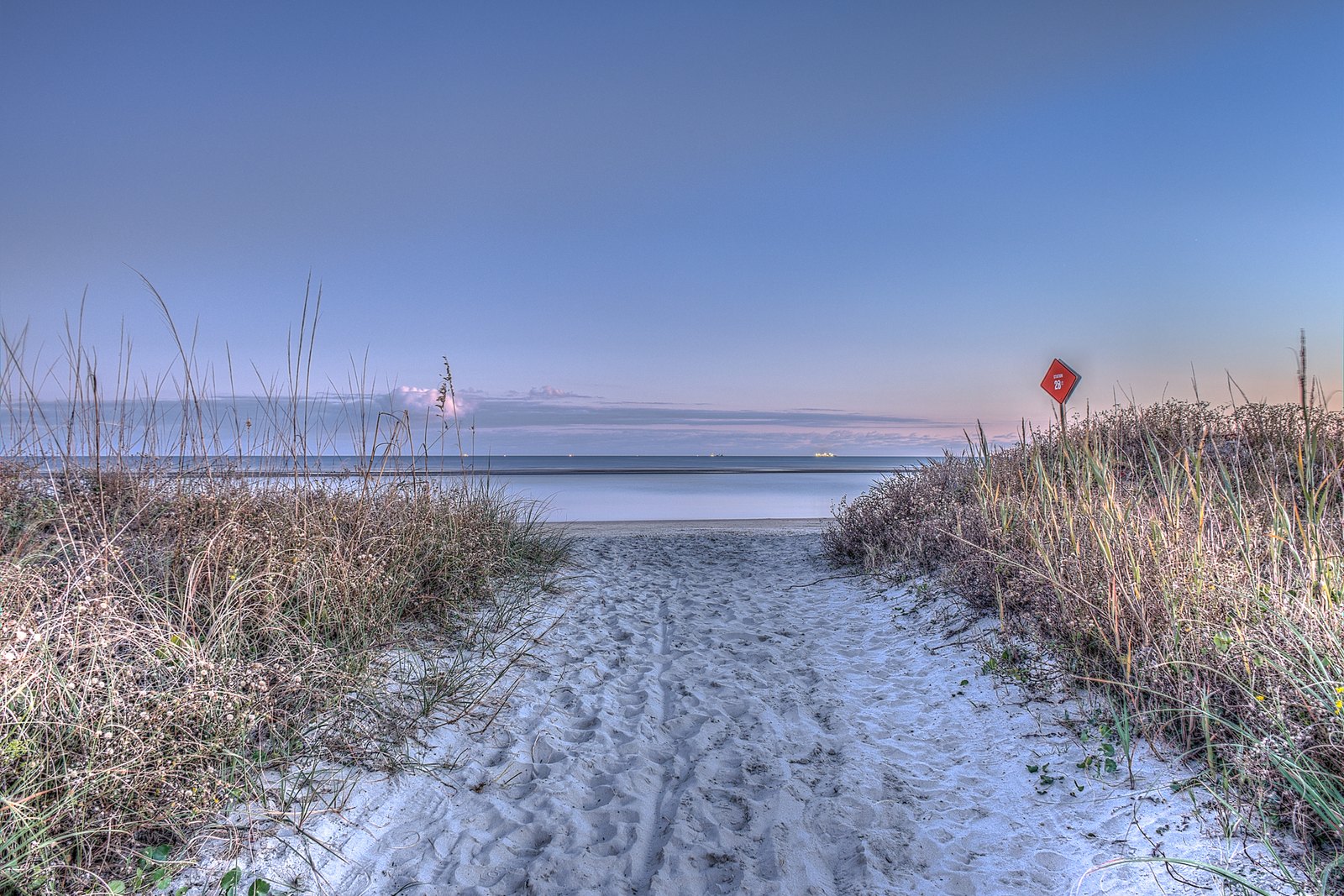 Sandy beach access path through dunes to the Atlantic on Sullivan's Island
